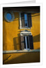 Shuttered Windows on Yellow Building by Anonymous