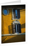 Shuttered Windows on Yellow Building by Anonymous