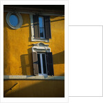 Shuttered Windows on Yellow Building by Anonymous