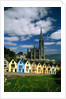 St. Coleman's Cathedral of Cobh Behind Colorful Row Houses by Anonymous