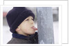 Boy Putting Tongue to Frozen Pole by Anonymous