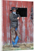 Cowboy Waiting at Barn by Anonymous