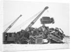 Crane Stacking Up Old Cars to be Burned in a Bonfire by Anonymous