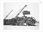 Crane Stacking Up Old Cars to be Burned in a Bonfire by Anonymous
