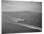 Howard Hughes' Spruce Goose Taxiing Across Water by Anonymous