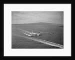 Howard Hughes' Spruce Goose Taxiing Across Water by Anonymous
