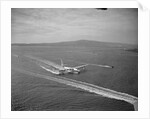 Howard Hughes' Spruce Goose Taxiing Across Water by Anonymous
