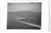 Howard Hughes' Spruce Goose Taxiing Across Water by Anonymous
