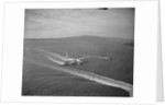 Howard Hughes' Spruce Goose Taxiing Across Water by Anonymous