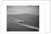 Howard Hughes' Spruce Goose Taxiing Across Water by Anonymous