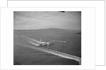 Howard Hughes' Spruce Goose Taxiing Across Water by Anonymous