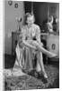 Woman Putting On Stockings by Anonymous