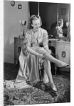 Woman Putting On Stockings by Anonymous