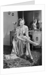 Woman Putting On Stockings by Anonymous