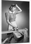 Woman Hard at Work Ironing by Anonymous