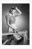 Woman Hard at Work Ironing by Anonymous