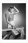 Woman Hard at Work Ironing by Anonymous