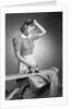 Woman Hard at Work Ironing by Anonymous