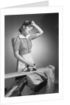 Woman Hard at Work Ironing by Anonymous