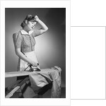 Woman Hard at Work Ironing by Anonymous