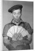 Man Holding Fan of Money by Anonymous
