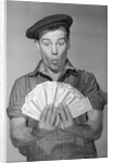 Man Holding Fan of Money by Anonymous