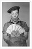 Man Holding Fan of Money by Anonymous