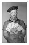 Man Holding Fan of Money by Anonymous