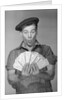 Man Holding Fan of Money by Anonymous