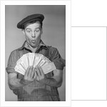 Man Holding Fan of Money by Anonymous