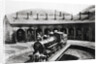 Round House With Train In Center by Anonymous