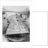 Huge Supercarrier Sailing Under Bridge by Anonymous
