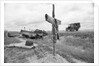 Ambulance Driving By Grave With Cross by Anonymous