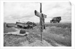 Ambulance Driving By Grave With Cross by Anonymous