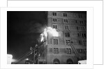 Firemen On Ladder At Flame-Engulfed Wind by Anonymous