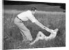Young Couple Frolicking in Grass by Anonymous