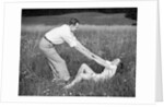 Young Couple Frolicking in Grass by Anonymous