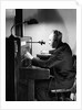 Man Connecting Call At Switchboard by Anonymous