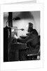 Man Connecting Call At Switchboard by Anonymous