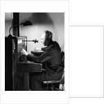 Man Connecting Call At Switchboard by Anonymous