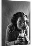Girl Sipping a Soda by Anonymous