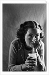 Girl Sipping a Soda by Anonymous