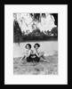 Twin Sisters Sitting Back to Back by Anonymous