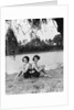 Twin Sisters Sitting Back to Back by Anonymous