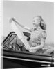 Young Woman Reading Road Map by Anonymous