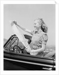 Young Woman Reading Road Map by Anonymous