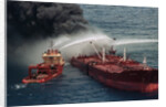 Boat Pours Water On Burning Oil Tanker by Anonymous