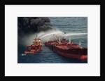 Boat Pours Water On Burning Oil Tanker by Anonymous