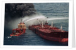 Boat Pours Water On Burning Oil Tanker by Anonymous