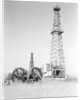 Oil Derricks In Field by Anonymous